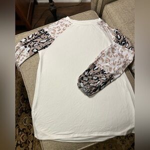 Ivory size L tunic with multi-colored animal print balloon sleeves